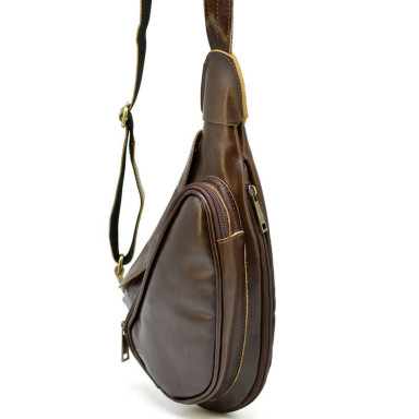 Leather backpack TARWA AC-3026-3md on one shoulder with a patch pocket