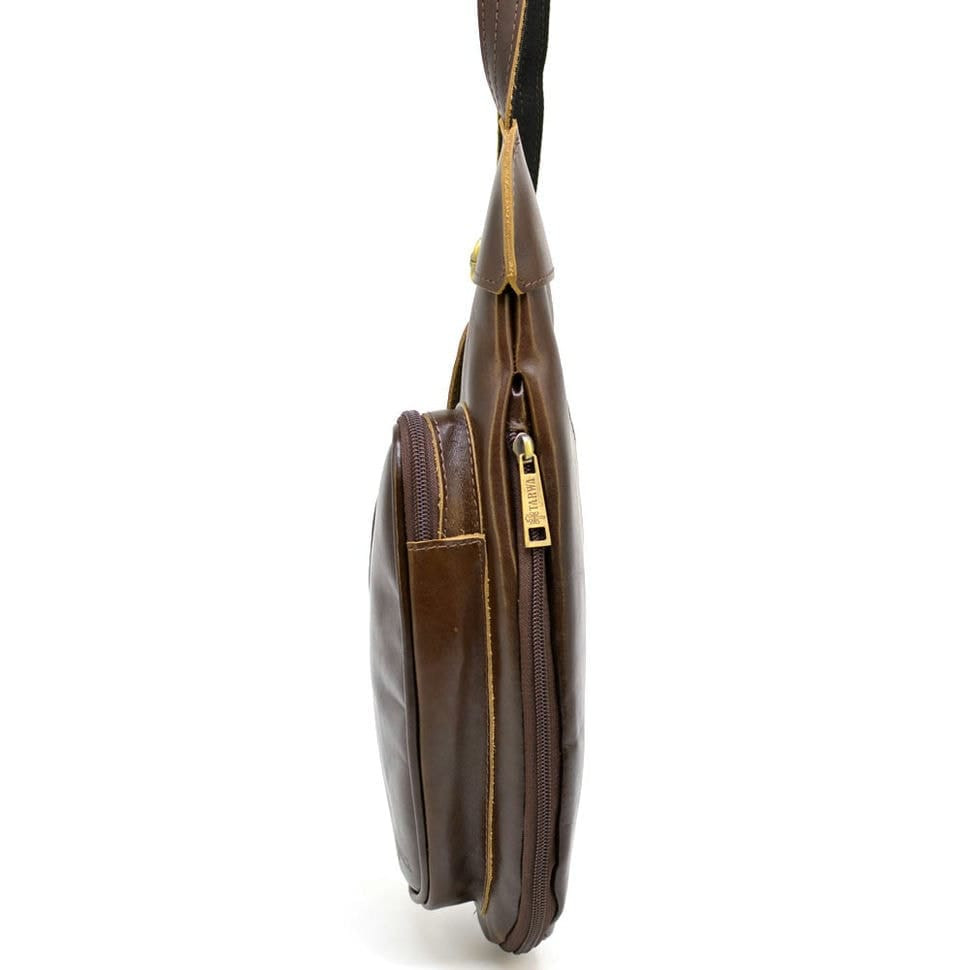 Leather backpack TARWA AC-3026-3md on one shoulder with a patch pocket