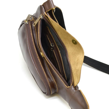 Leather backpack TARWA AC-3026-3md on one shoulder with a patch pocket