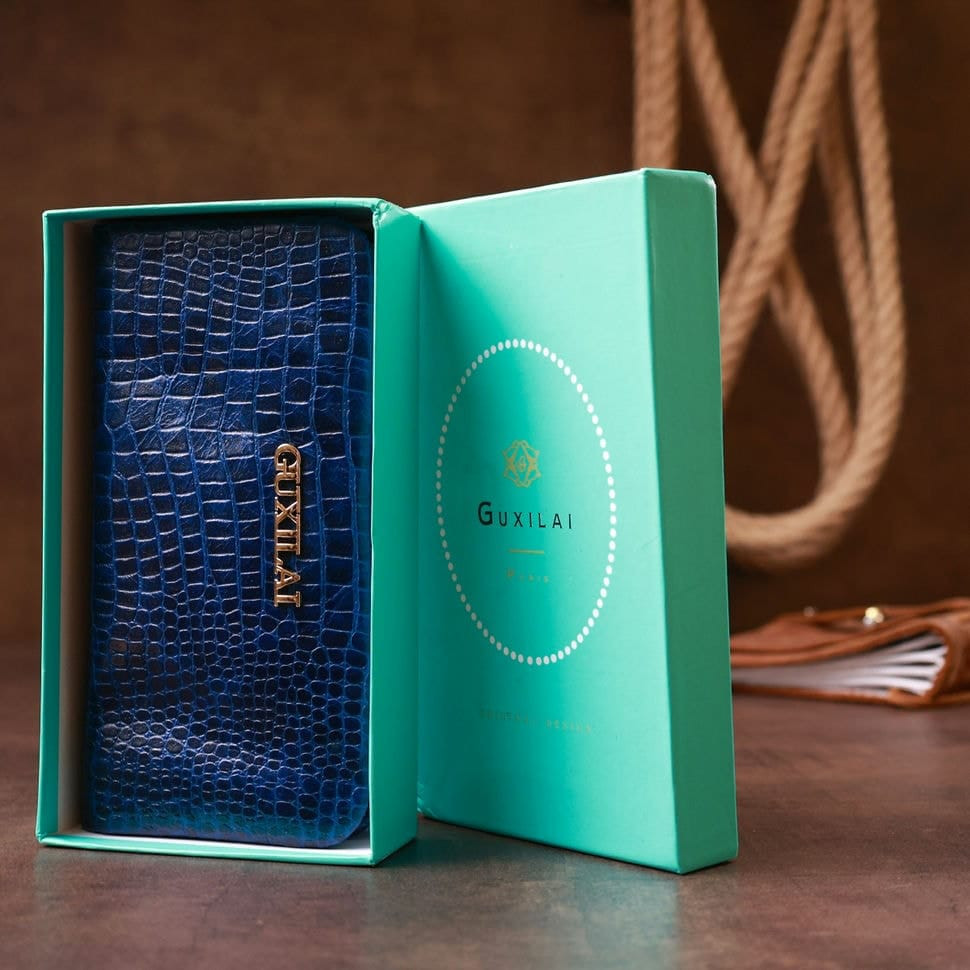 Гаманець жіночий шкіряний з тисненням під екзотику Guxilai 18963 Синій