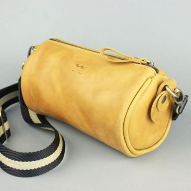Cylinder yellow vintage leather crossbody bag