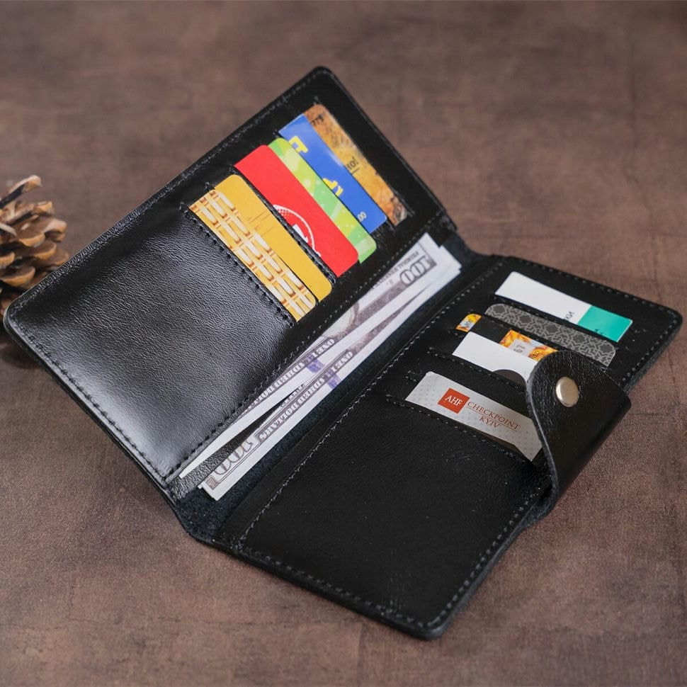 Гаманець чоловічий вертикальний зі шкіри Алькор на кнопках SHVIGEL 16173 Чорний