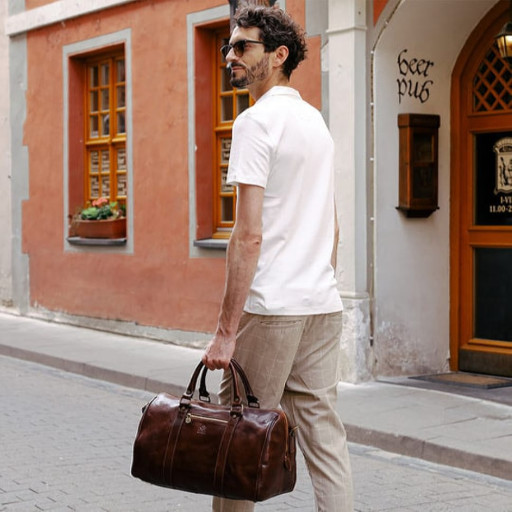 Невелика шкіряна сумка дорожня - The Ambassadors - коричнева Time Resistance 5192101