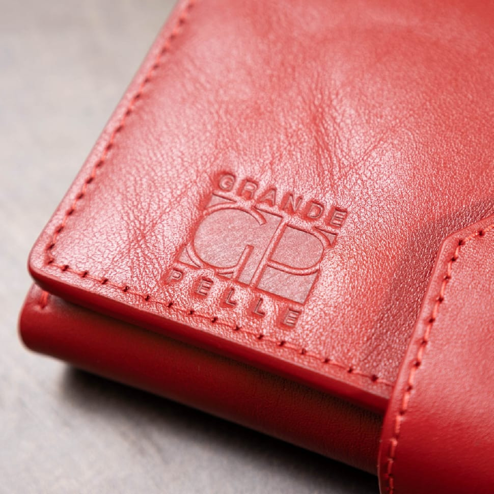 Шикарний жіночий гаманець у три складання GRANDE PELLE 11564 Червоний